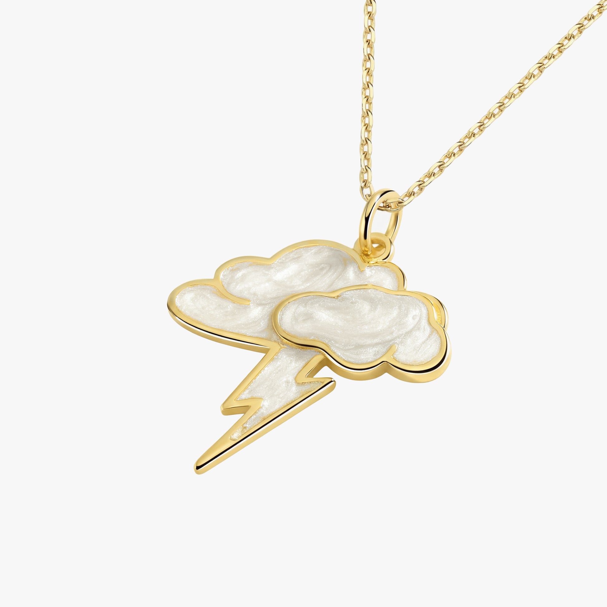 Gold necklace with a cloud and lightning bolt pendant on a white background
