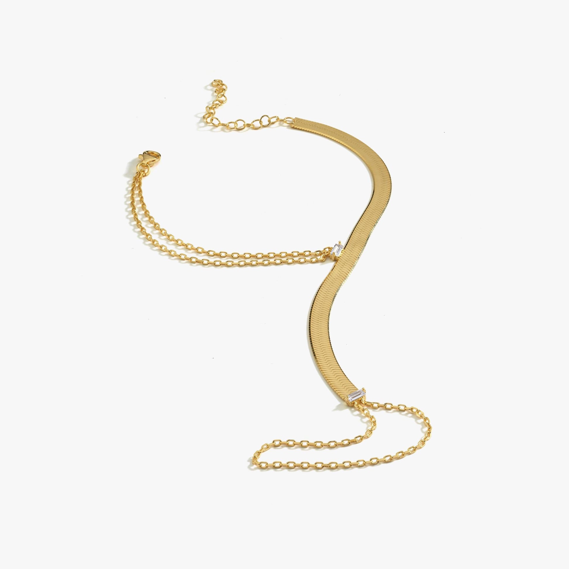 18K gold herringbone hand chain bracelet laid flat on a white background.