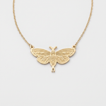 Gold moth necklace with leaf-engraved wings and moon phase body, a moth pendant on a fine cable chain