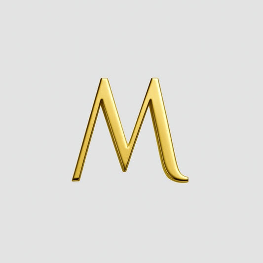 Gold letter 'M' on a light gray background