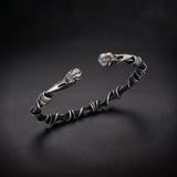 Men's bird skull cuff bracelet in 925 sterling silver with a twisted wire band