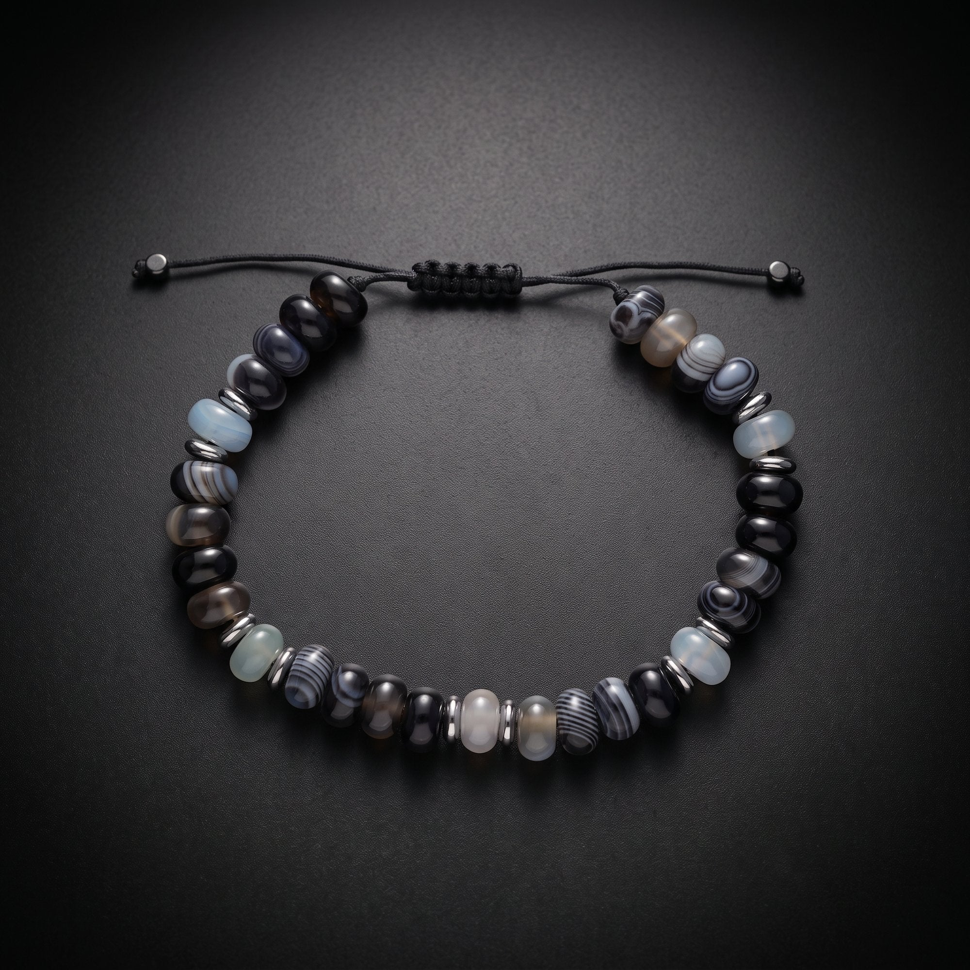 Men's beaded bracelet with blue sea sediment jasper and onyx natural stones on an adjustable cord