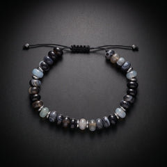 Men's beaded bracelet with blue sea sediment jasper and onyx natural stones on an adjustable cord