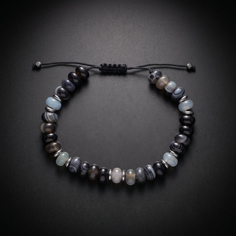 Men's beaded bracelet with blue sea sediment jasper and onyx natural stones on an adjustable cord