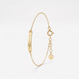 Engraved gold bar bracelet with a Roman numeral date, a personalized coordinates bracelet in 14K solid gold on a dainty chain
