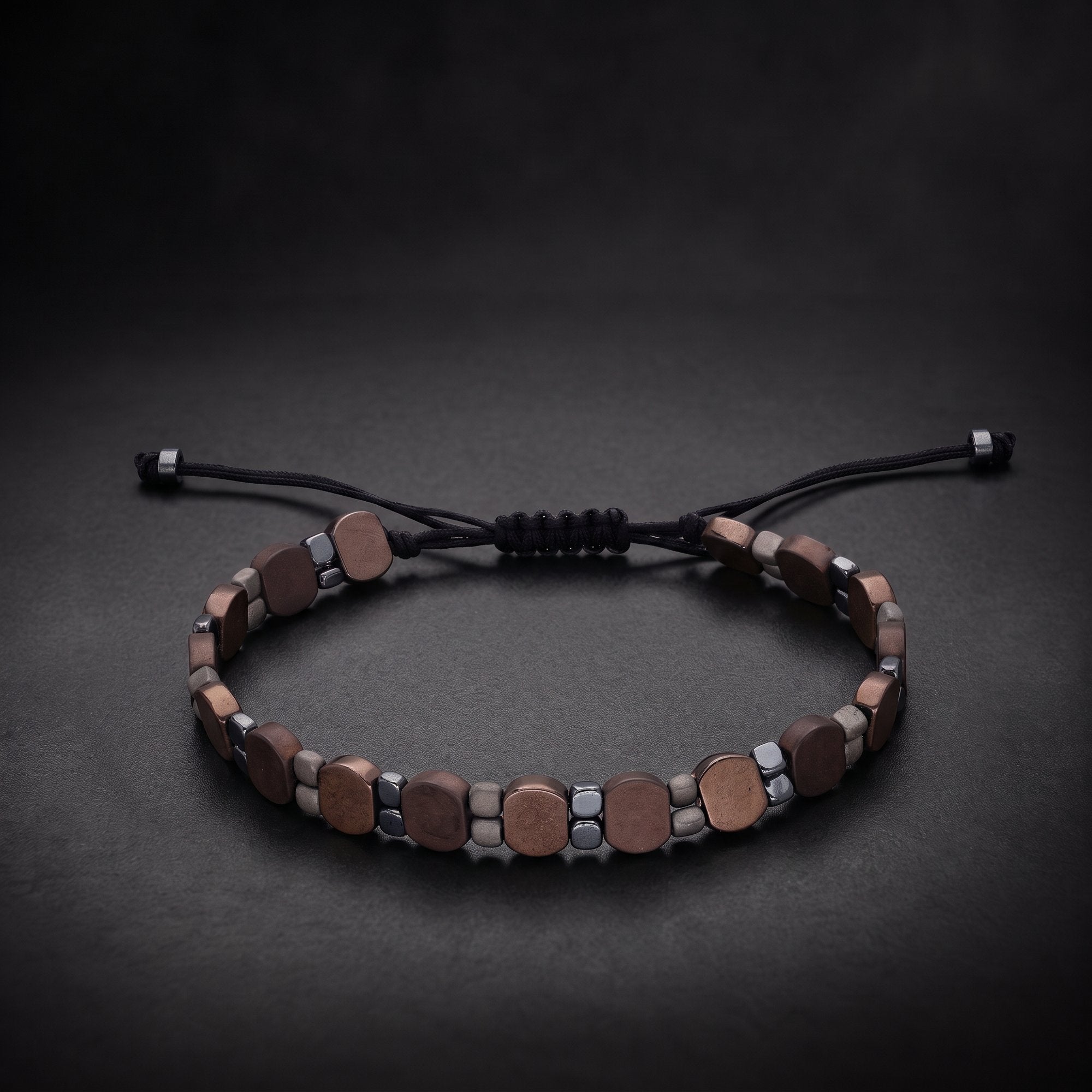 Handcrafted men's copper hematite natural stone bracelet on an adjustable black cord