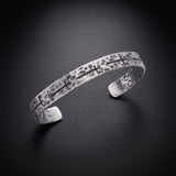 Men's hammered cross cuff bracelet in oxidized sterling silver