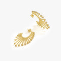 A pair of 14K gold vermeil sunburst earrings laid on a white surface, each designed with a semi-circular ridge and multiple dangling golden beads.