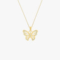 A sparkling 18K gold vermeil butterfly pendant on a fine gold chain, isolated on a white background.