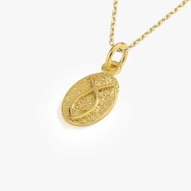 Detailed view of a 14K gold vermeil Christian fish necklace, showcasing an oval pendant with a textured finish and the ichthys symbol.