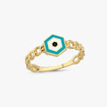 A detailed, isolated view of a gold chain ring featuring a hexagonal design with blue, white, and black colors forming an evil eye pattern.