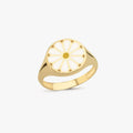 Close-up of a 14K solid gold ring featuring a white and yellow daisy design.