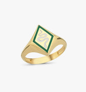 A gold snake signet ring with a green and white enamel snake design on a plain white background.