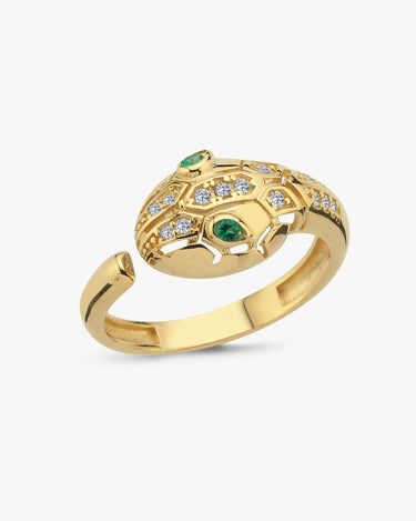 Gold Ouroboros thumb ring with green gemstones and diamond accents on a white background.