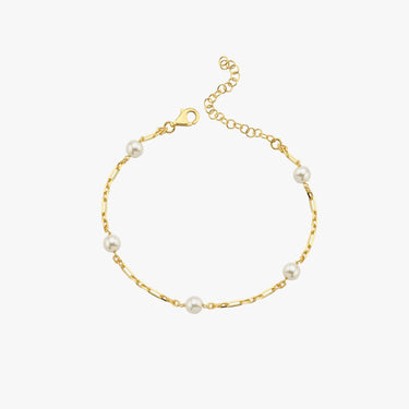 A minimalistic 18K gold vermeil bracelet with evenly spaced white pearls, elegantly laid out against a white background, displaying the simplicity and charm of the design.