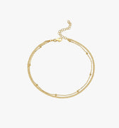 A standalone view of the 18K gold vermeil double chain anklet, displayed on a white background.