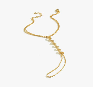 A single gold snake hand chain bracelet with a zigzag design, laid flat against a white background.