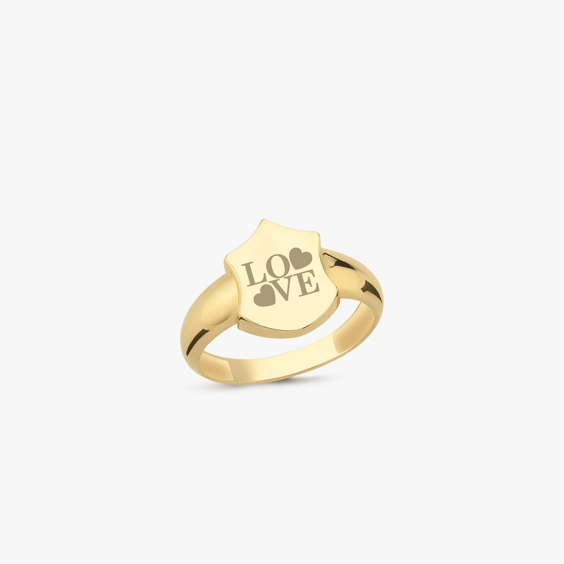 A 14K solid gold initial ring with a shield-shaped face engraved with the word &quot;LOVE&quot; and two heart symbols, displayed on a plain white background.