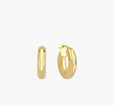 Two chunky 18K gold vermeil hoop earrings placed upright against a white background, emphasizing their smooth, polished surface and thick, rounded design.