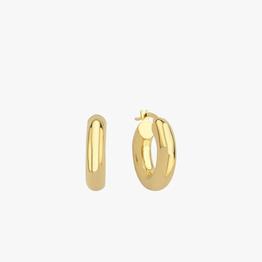 Two chunky 18K gold vermeil hoop earrings placed upright against a white background, emphasizing their smooth, polished surface and thick, rounded design.