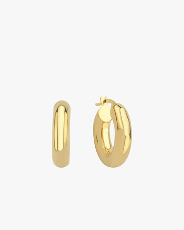 Two chunky 18K gold vermeil hoop earrings placed upright against a white background, emphasizing their smooth, polished surface and thick, rounded design.