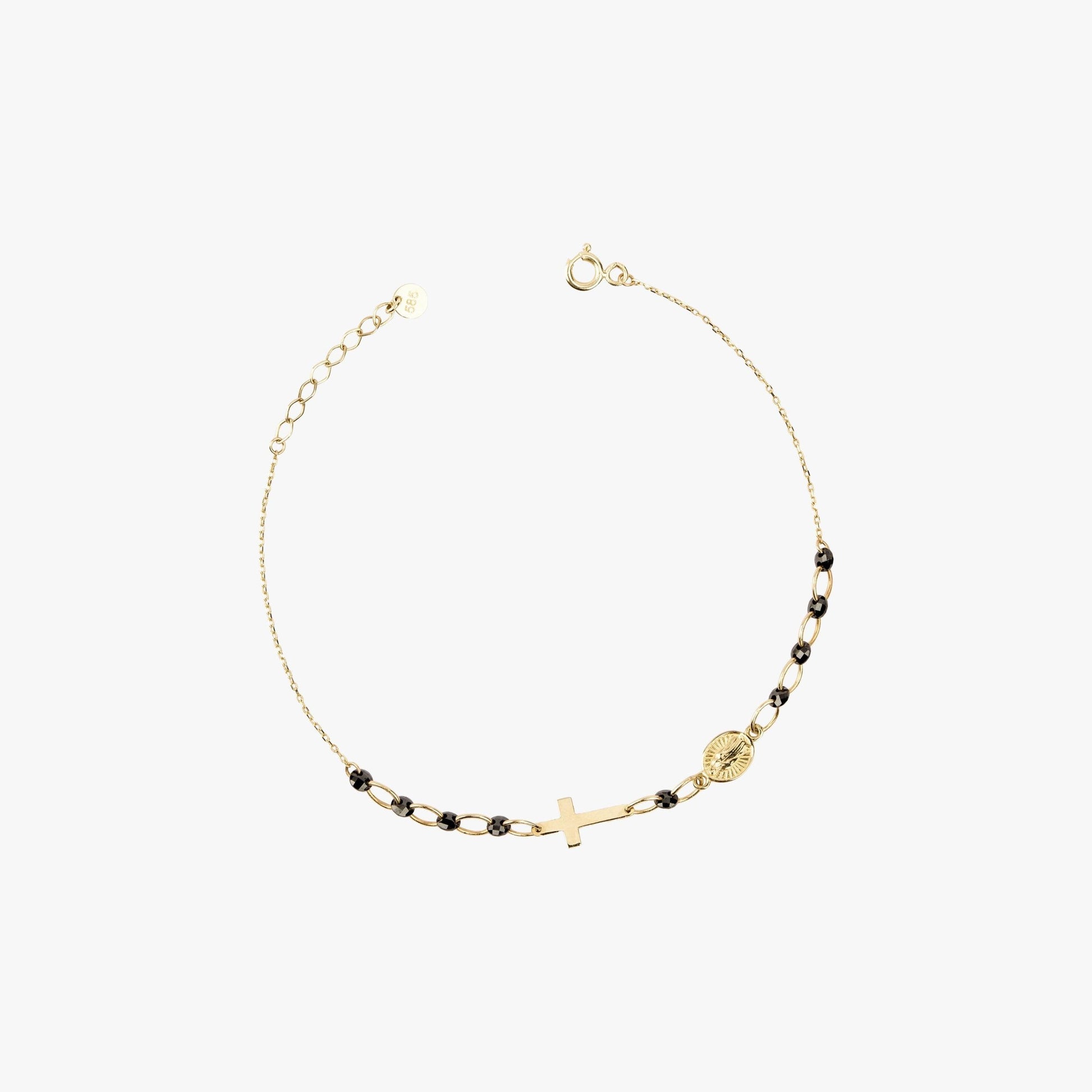 Product image of a 14K solid gold onyx rosary bracelet laid out on a white background. The bracelet features a gold cross and medallion charm, with small black beads interspersed along the chain.