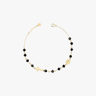 A 14K gold bracelet with black onyx beads, a cross charm, and a small medallion, displayed flat on a white background.