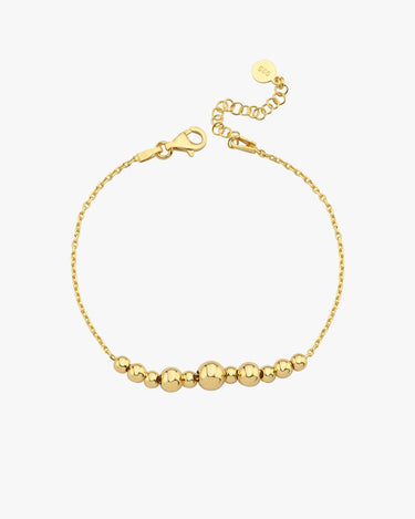 A high-angle view of the 18K Gold Vermeil beaded bracelet, highlighting its smooth, polished beads and secure clasp against a white background.