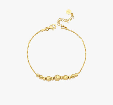 A high-angle view of the 18K Gold Vermeil beaded bracelet, highlighting its smooth, polished beads and secure clasp against a white background.