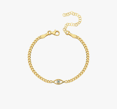 18K Gold Vermeil Evil Eye Curb Chain Bracelet laid flat on a white surface, highlighting the gold curb chain and the eye-shaped charm with a clear gemstone in the center.