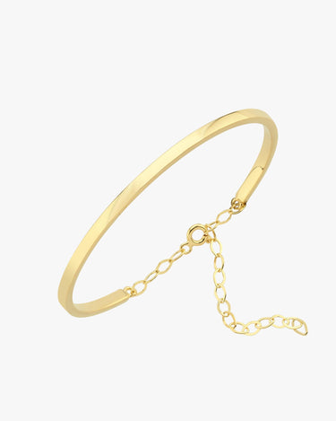 A thin gold vermeil bangle bracelet with a chain clasp, lying flat on a white background.