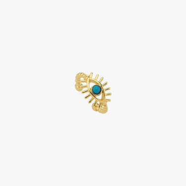 Gold vermeil evil eye ear cuff featuring a turquoise stone at its center, displayed against a white background.