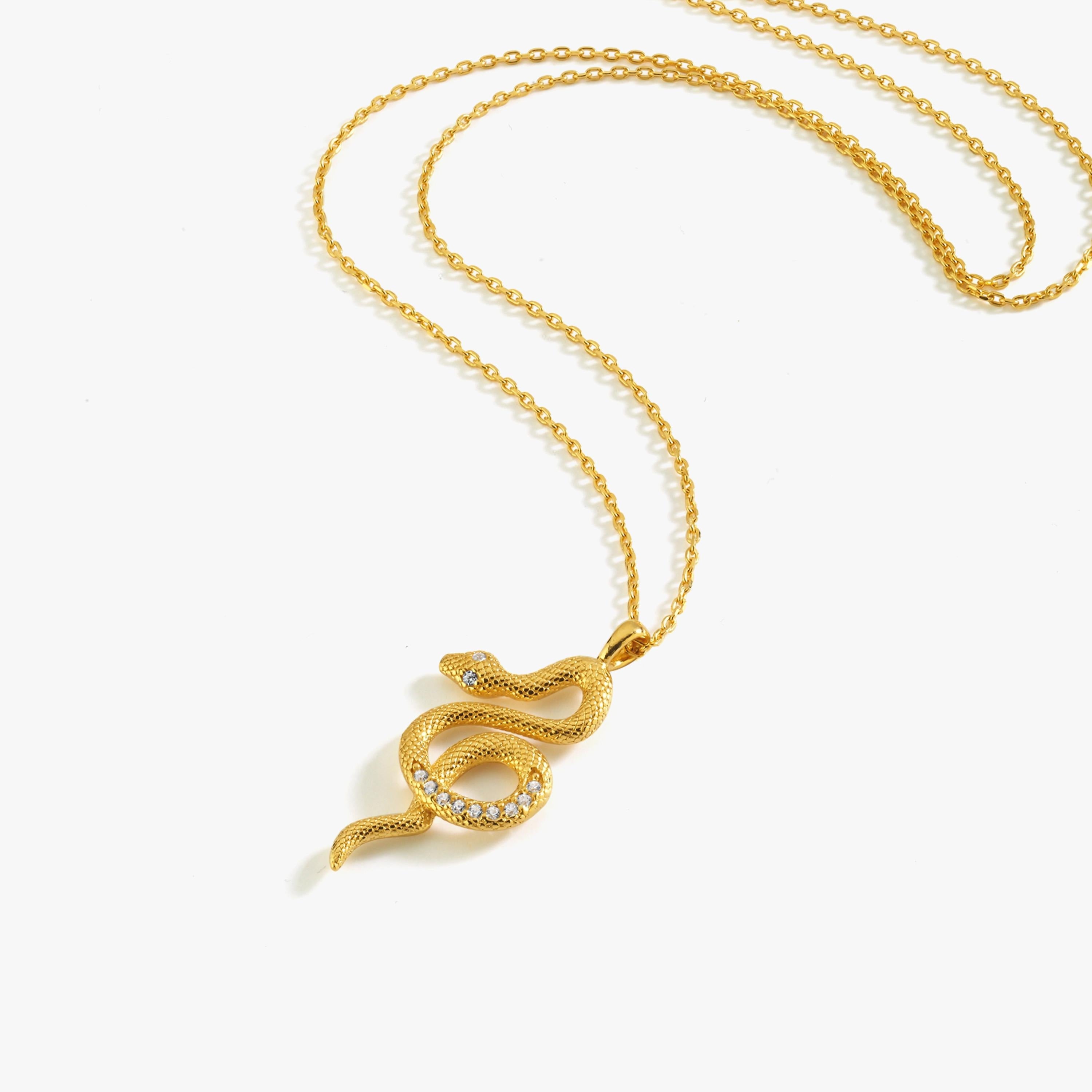 A standalone shot of the 18K Gold Vermeil Snake Necklace featuring a textured snake pendant with cubic zirconia accents.