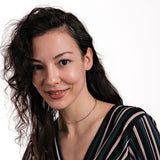 A delicate 18K Gold Vermeil Paperclip & Tennis Necklace resting elegantly on a woman's neck.