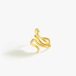 A close-up of a gold snake ring with a polished finish, featuring smooth, curving lines.