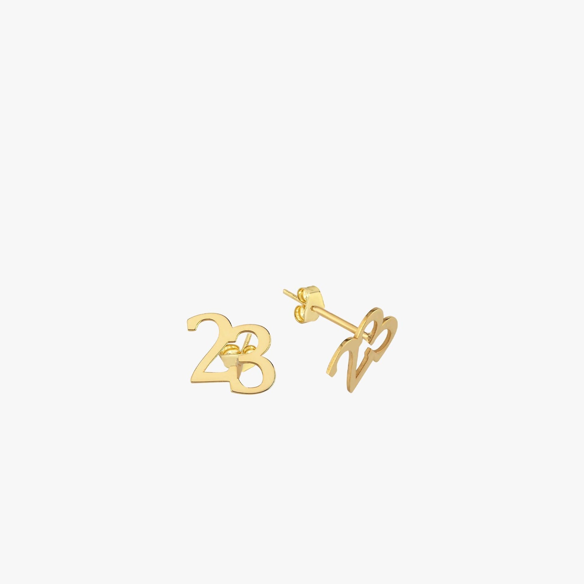 Minimalist flat-lay of 14K Solid Gold Number Stud Earrings designed as the number “23,” with classic push back closures.