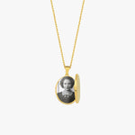 An elegant 18K Gold Vermeil Photo Locket Necklace displayed against a white background, with the locket opened to reveal a black and white photo inside.