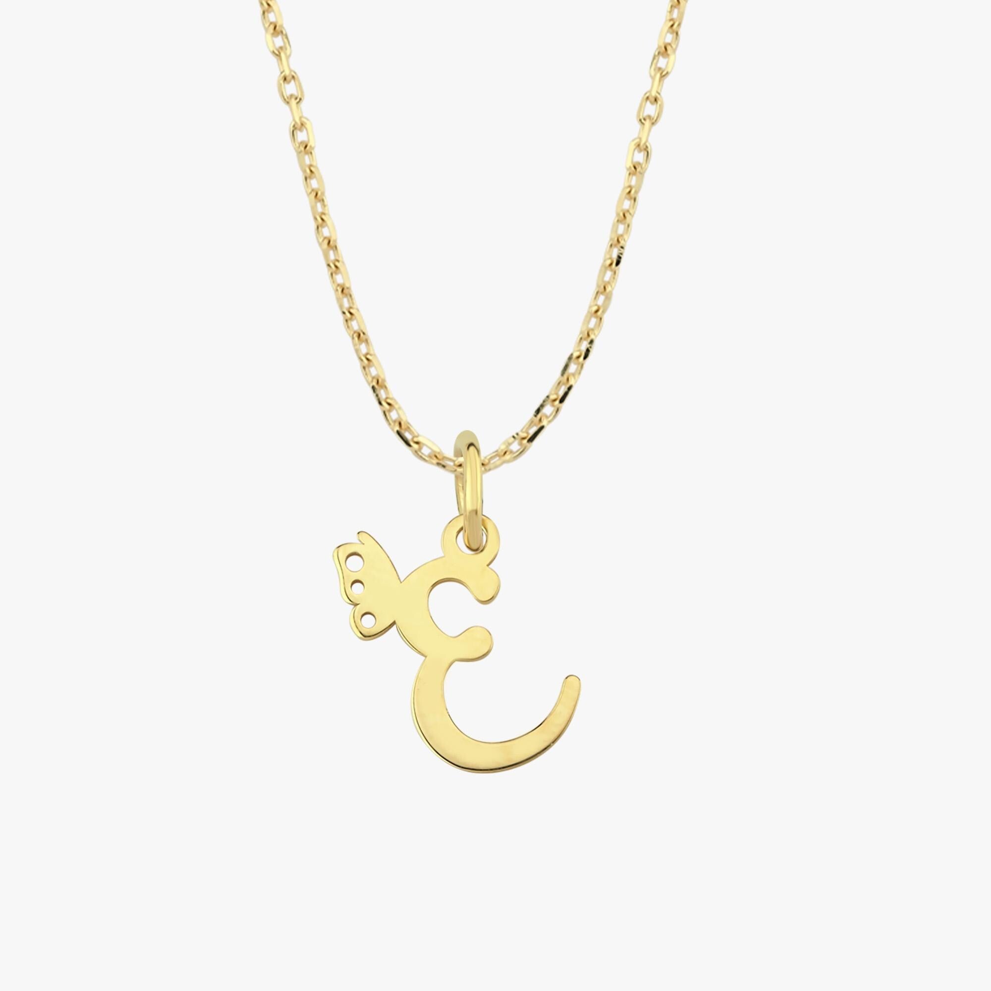 Delicate 14K solid gold custom letter necklace with butterfly charm laid flat on a white surface, highlighting the "E" initial pendant.