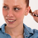 18K gold vermeil birthstone earrings and matching necklace with sapphire details, styled together for a coordinated look.