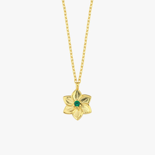 Centered close-up of 18K gold vermeil birth flower pendant necklace featuring a detailed emerald-set blossom.