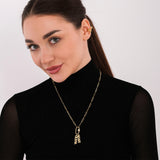 Paperclip chain gold vermeil carabiner charm necklace with custom letter pendants, displayed as a coiled flat lay on white surface.