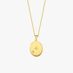 Front-facing view of the 18K Gold Vermeil Photo Locket Necklace showing a central star accent and elegant gold finish.