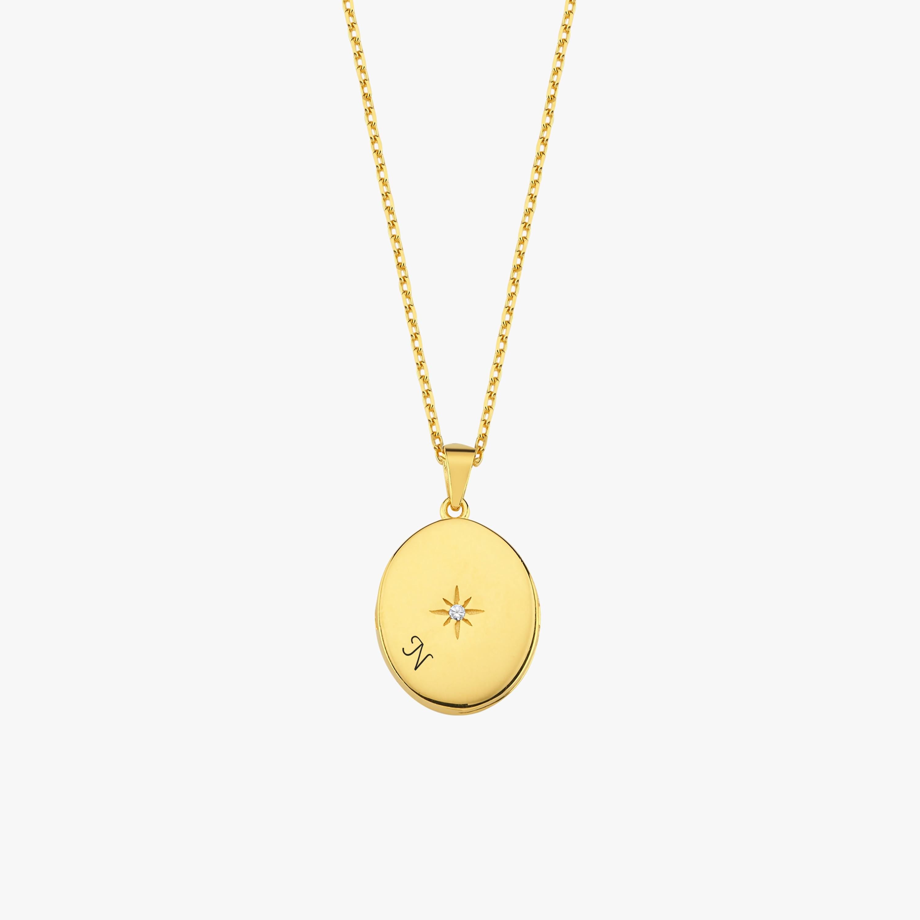 Front-facing view of the 18K Gold Vermeil Photo Locket Necklace showing a central star accent and elegant gold finish.