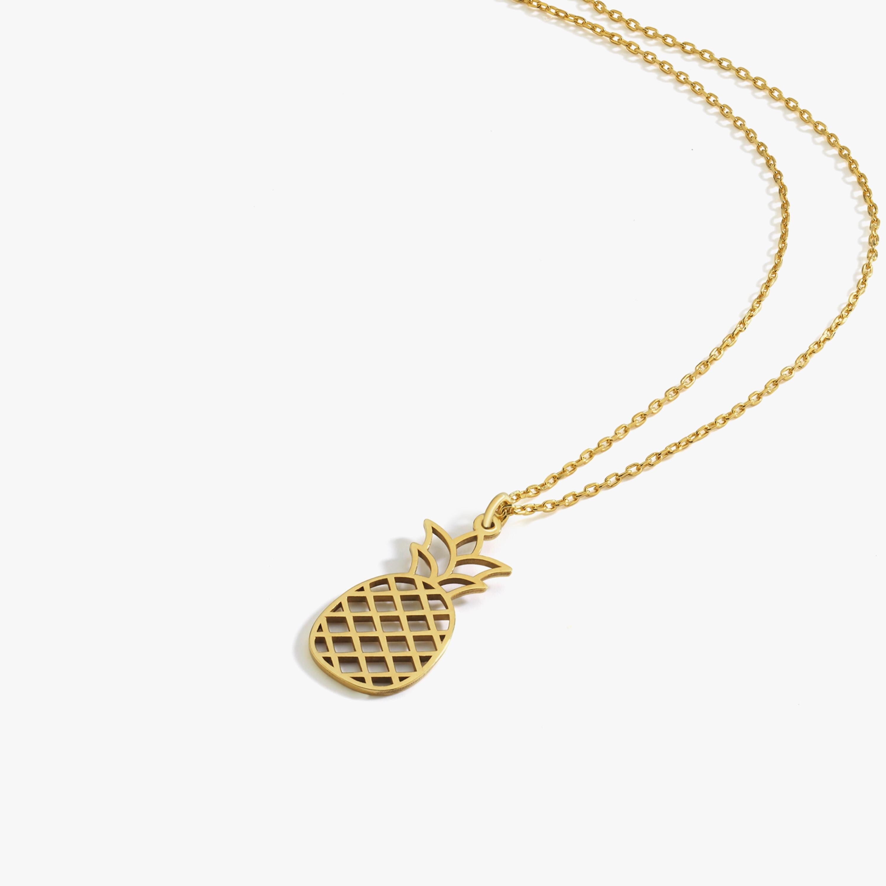 A close-up of the 14K Solid Gold Pineapple Fruit Necklace highlights the intricate cutout pineapple design.