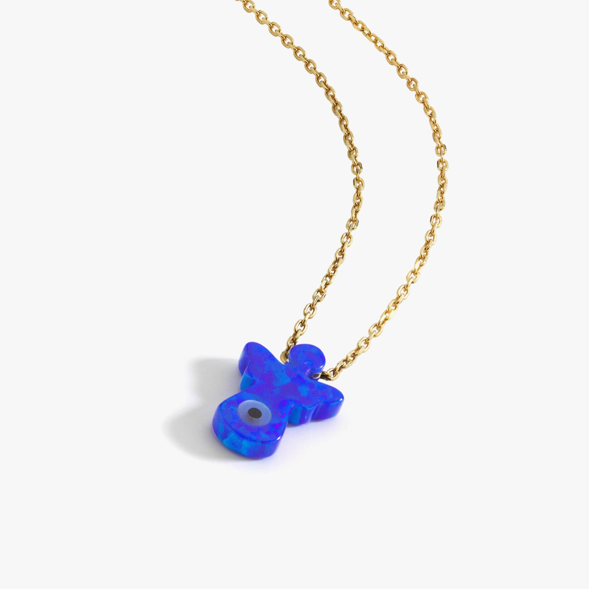 The 14K solid gold lucky symbol necklace displayed on a white bust, highlighting its delicate chain and vibrant blue charm.