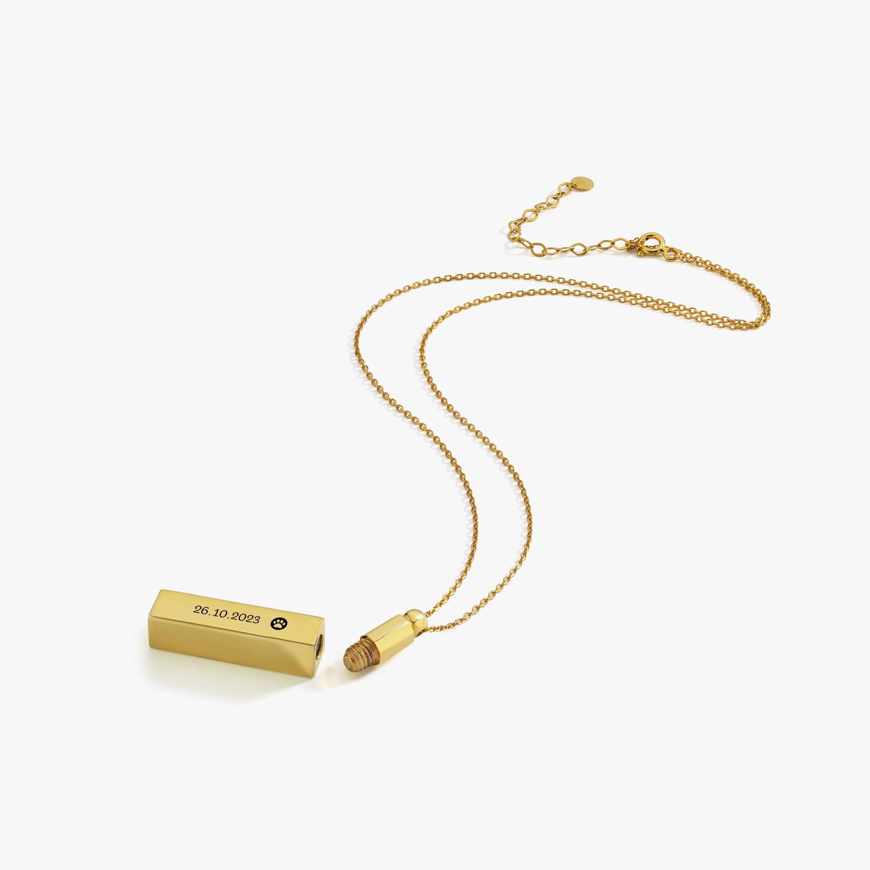 Disassembled 14K gold plated personalized cremation urn necklace showing screw top and compartment.