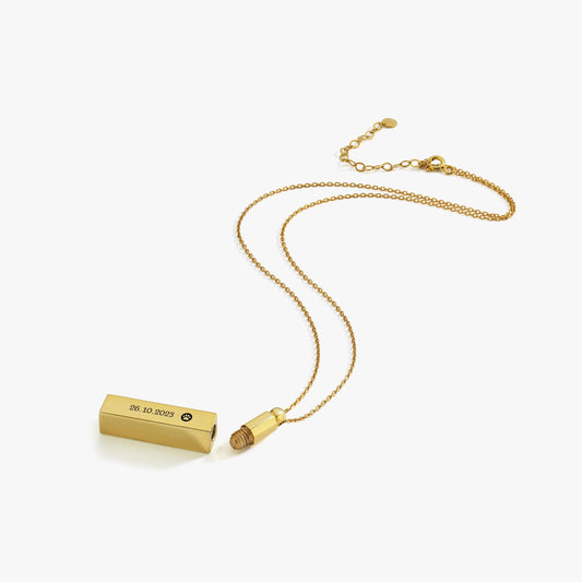 Disassembled 14K gold plated personalized cremation urn necklace showing screw top and compartment.
