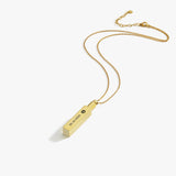 14K gold plated personalized cremation urn necklace with engraved date and paw symbol on pendant.