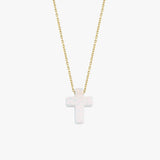 Minimalist studio view of a 14K solid gold necklace with a polished white opal cross pendant, centered on white.