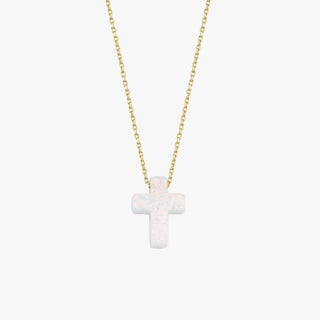 Minimalist studio view of a 14K solid gold necklace with a polished white opal cross pendant, centered on white.